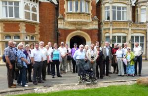 March Rotary Club Members pose outside Bletchley Park House.